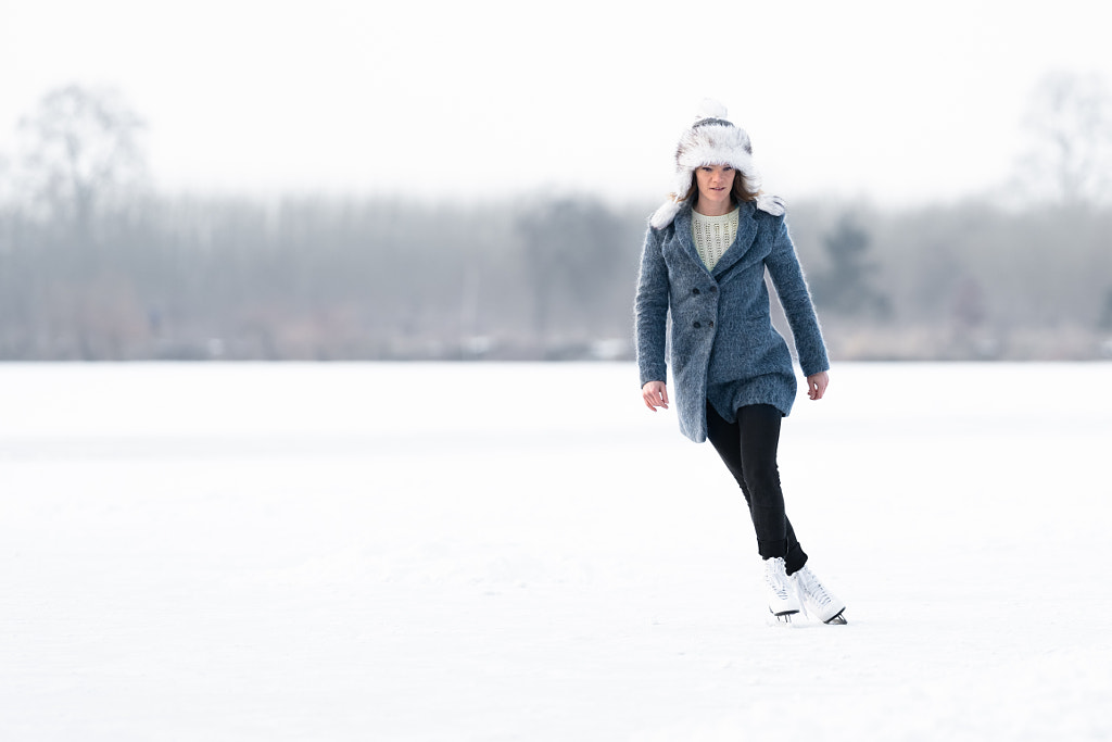 ice skating on the ice of a frozen lake young attractive woman by Eduard Goricev on 500px.com