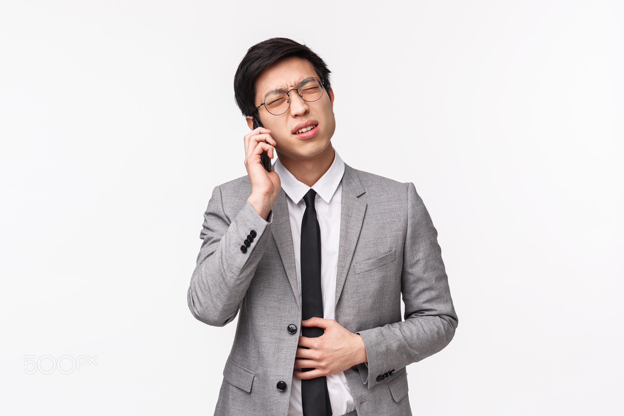 Waist-up portrait of sick young asian office manager calling employer