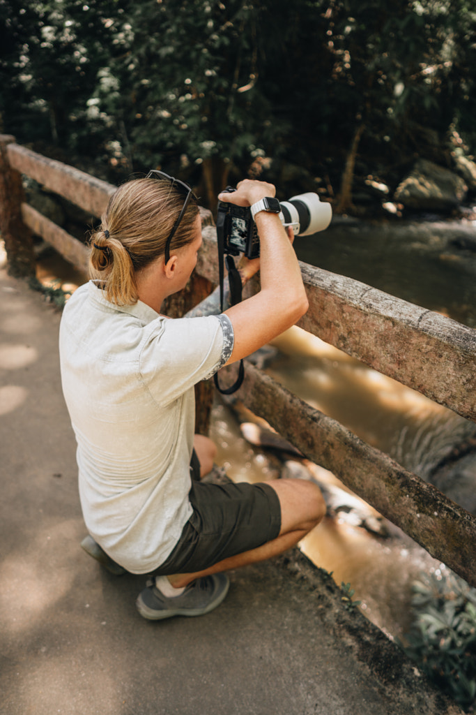 Man photographer making photos at Mae Sa waterfall in Chiang Mai by Natalie Zotova on 500px.com