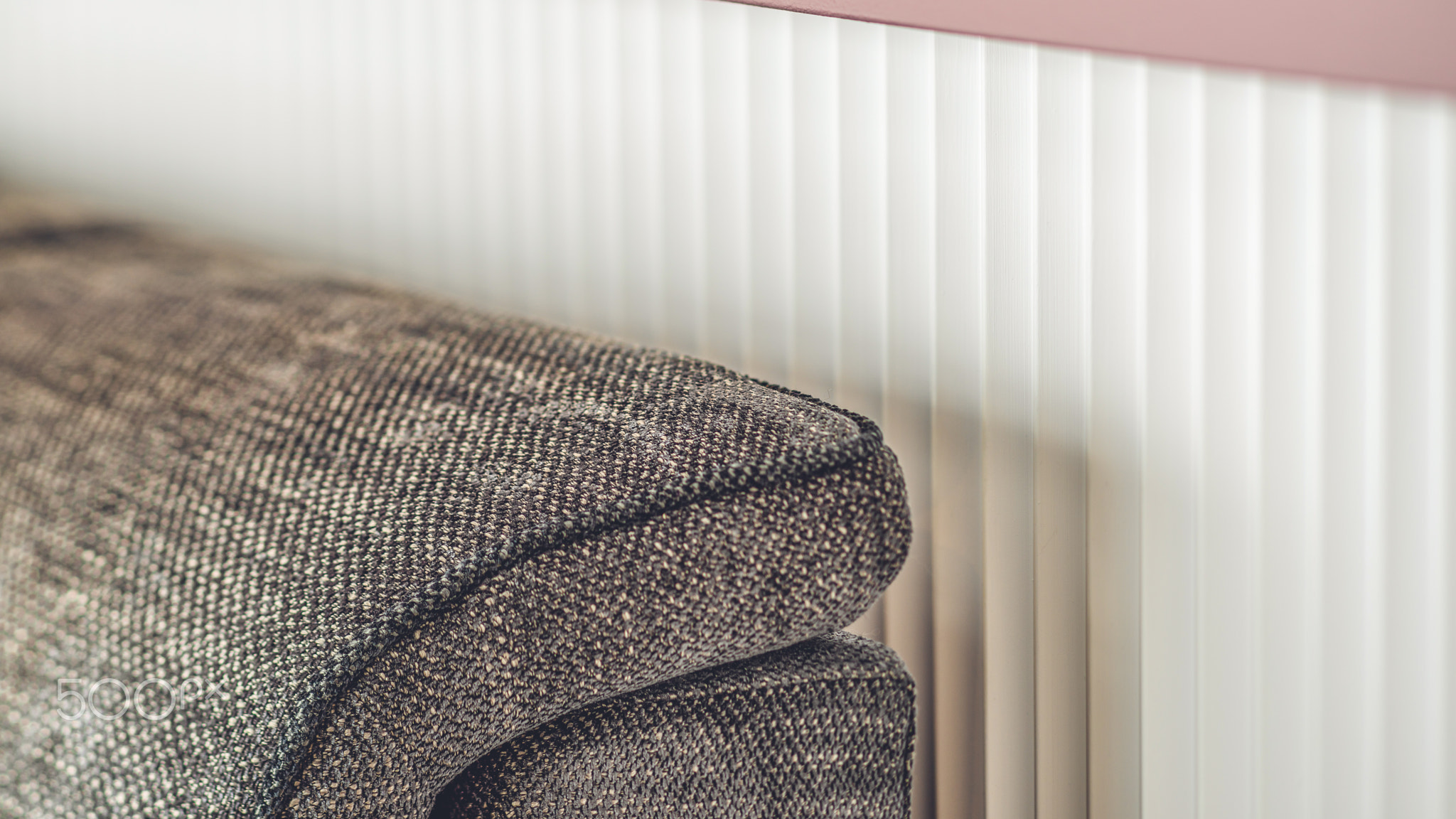 Close-up of armrest. Sofa upholstery detail.
