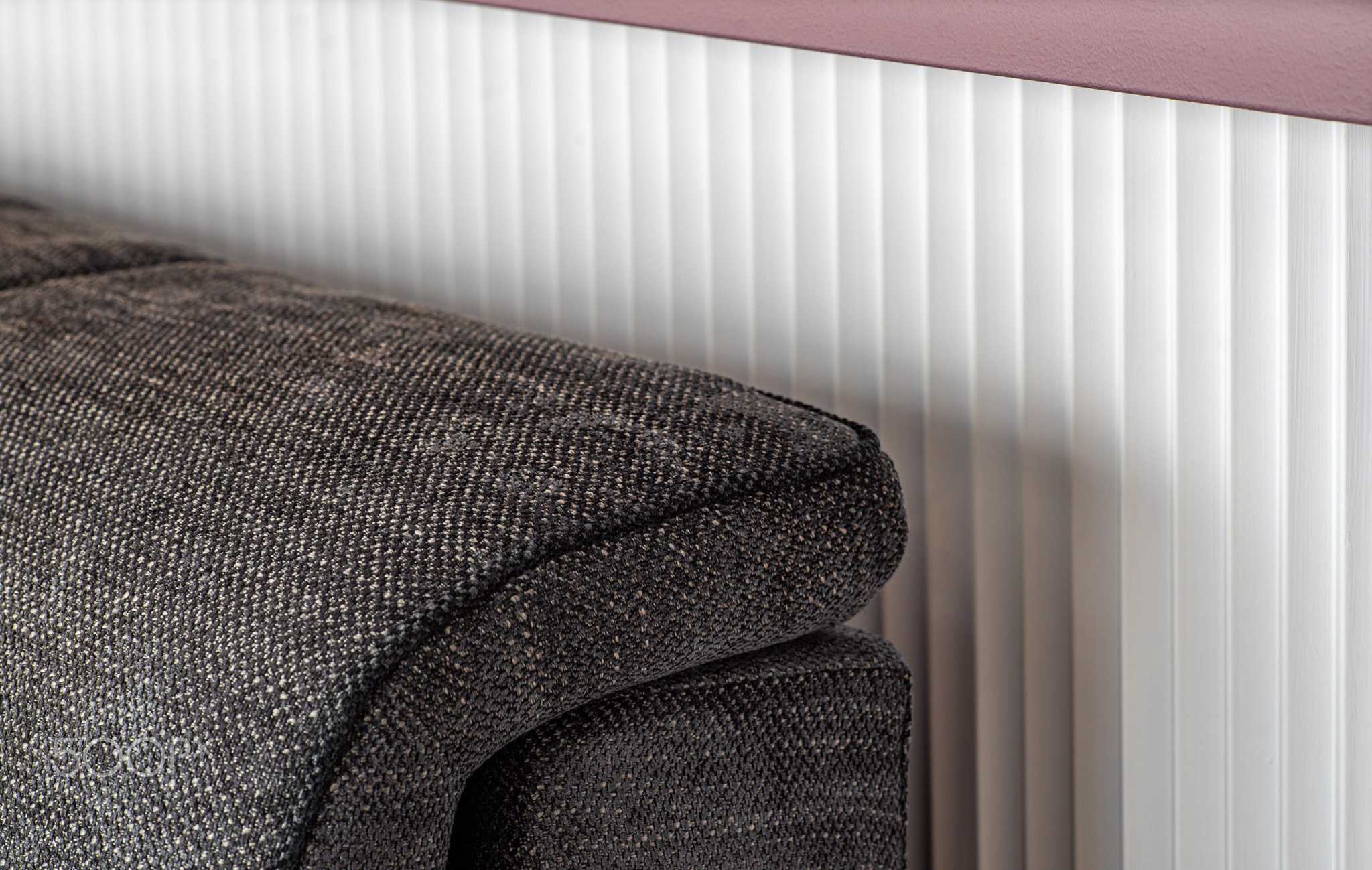 Close-up of armrest. Sofa upholstery detail.