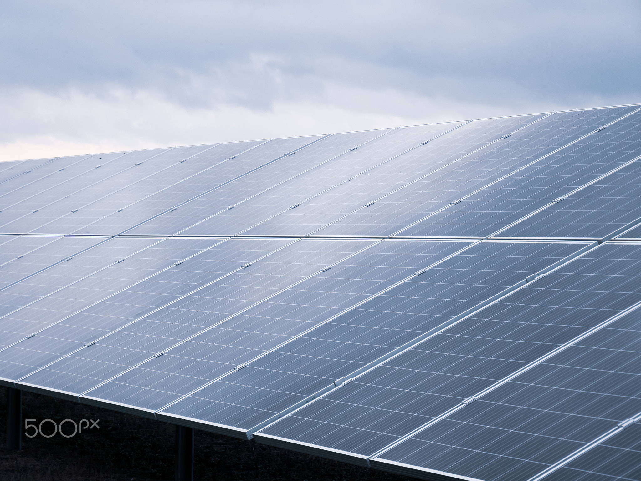 Dark blue solar station panels reflect light