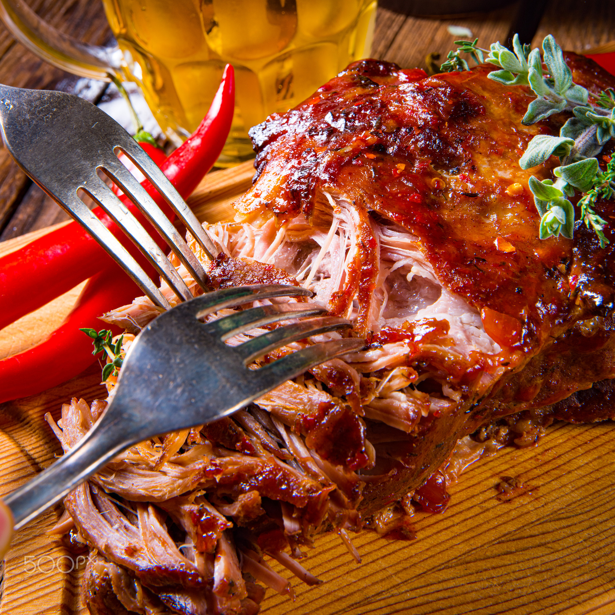 Pulled pork out of the oven with beer sauce