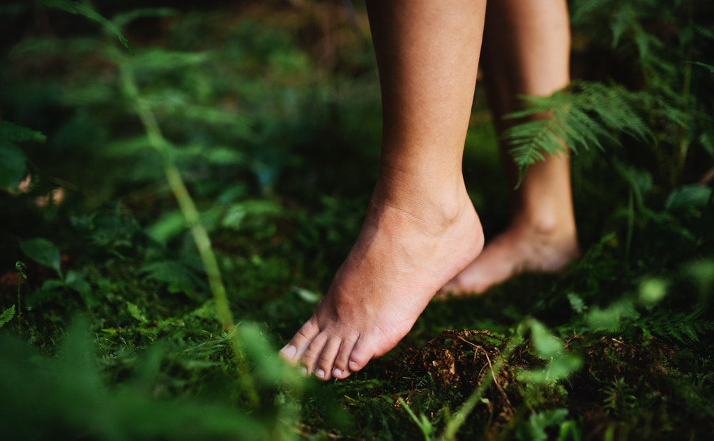 Bare feet of woman standing barefoot outdoors in nature, grounding by Jozef Polc on 500px.com