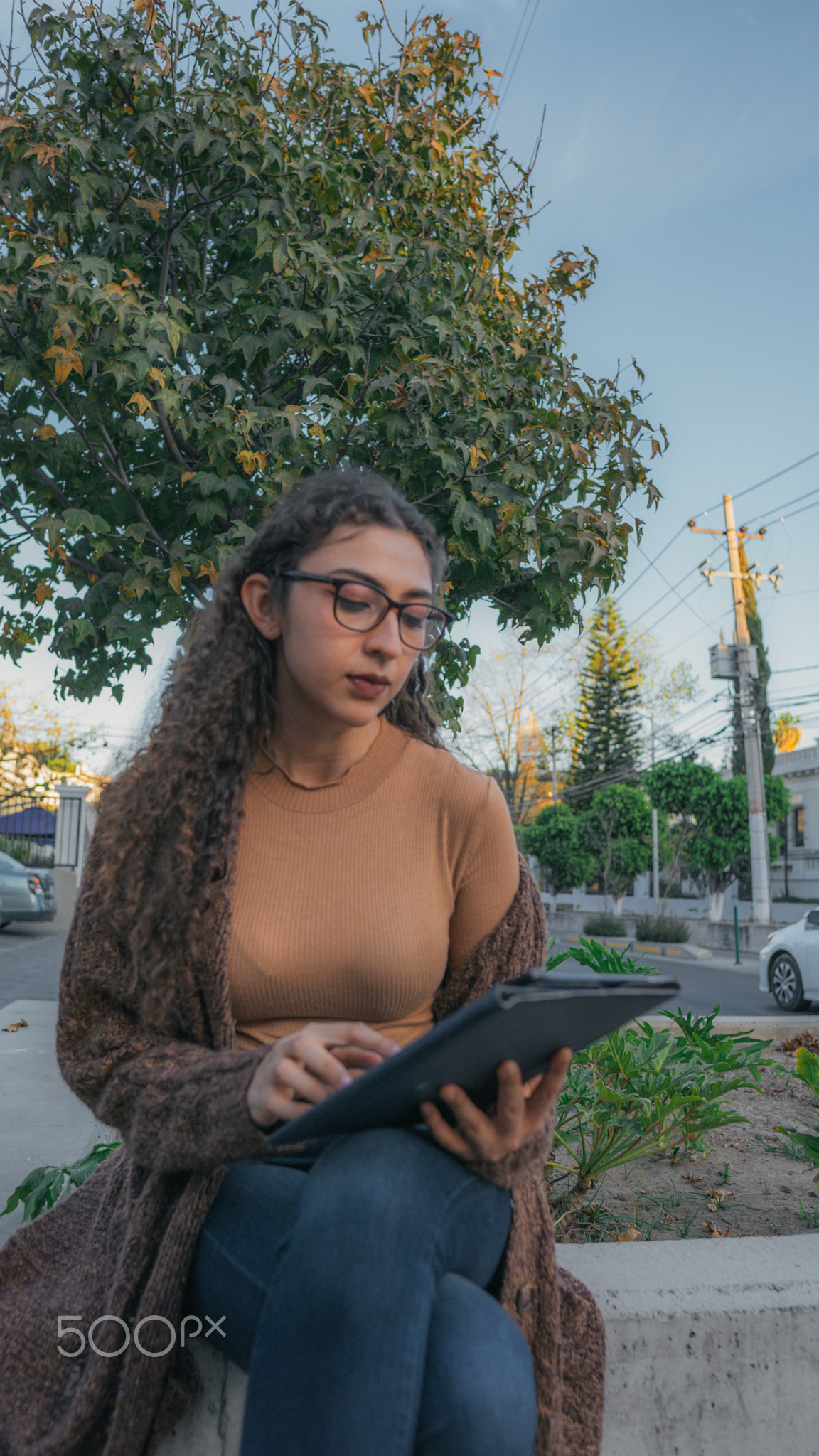 Woman on the street using her Ipad