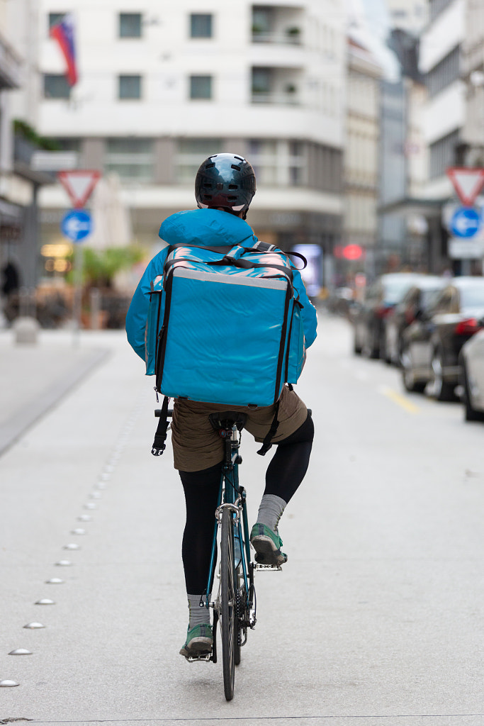 Courier On Bicycle Delivering Food In City. by Matej Kastelic on 500px.com