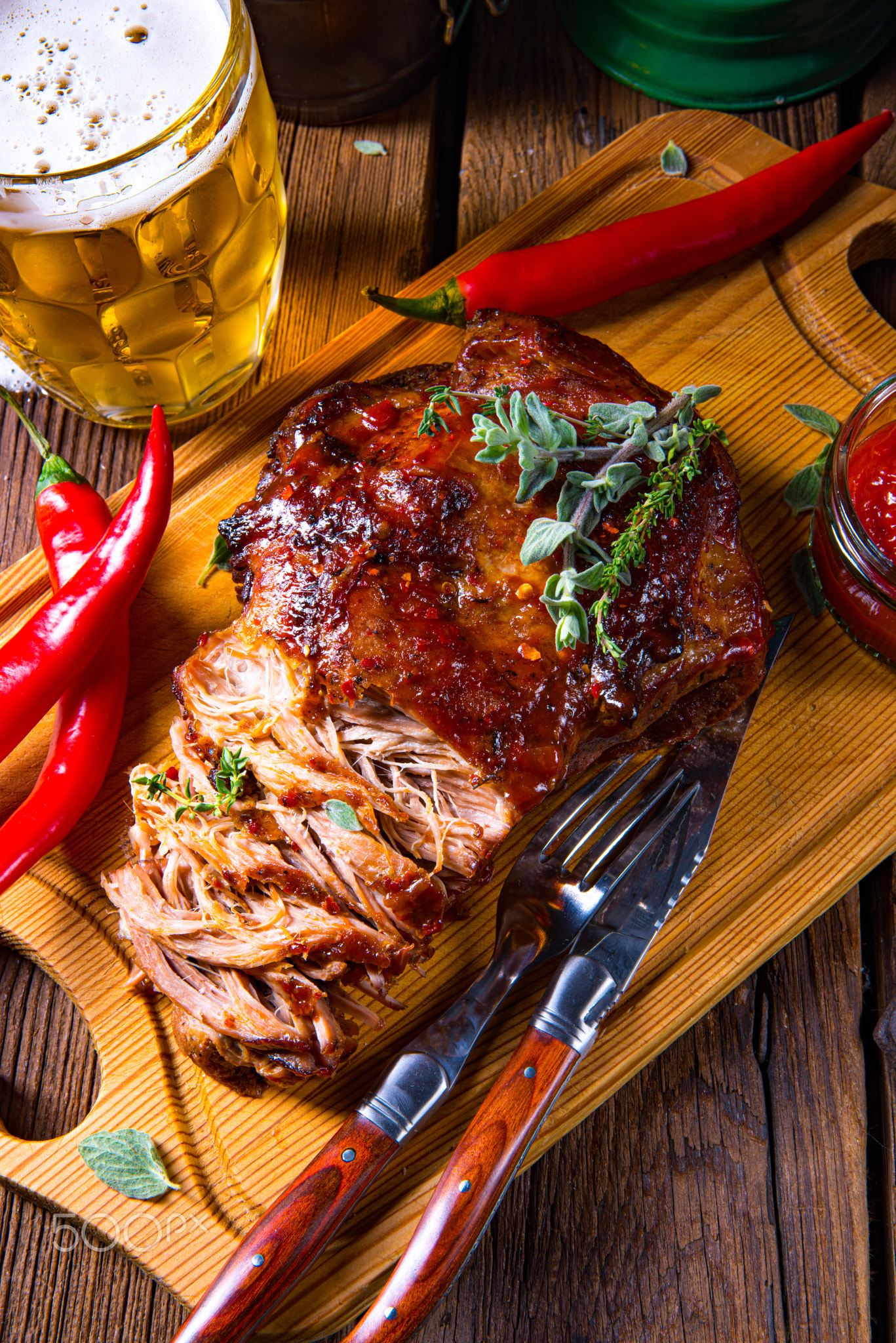 Pulled pork out of the oven with beer sauce