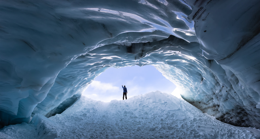 Man Hiking at a beautiful Ice Cave in the Alpines by Edgar Bullon on 500px.com