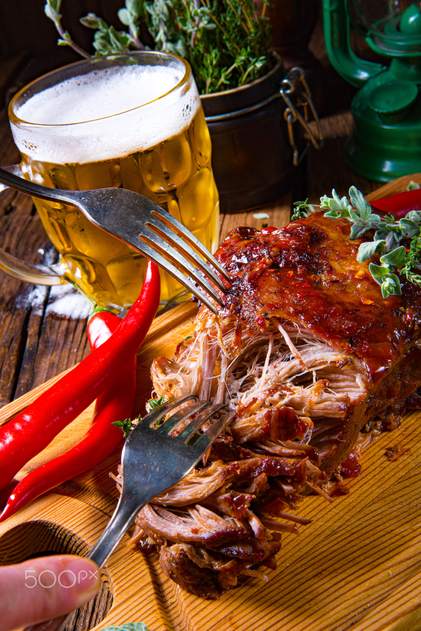 Pulled pork out of the oven with beer sauce