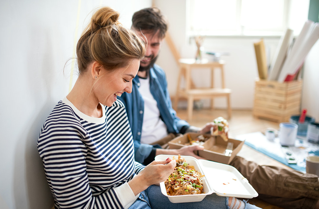 Couple eating lunch indoors at home, relocation, diy and food delivery by Jozef Polc on 500px.com