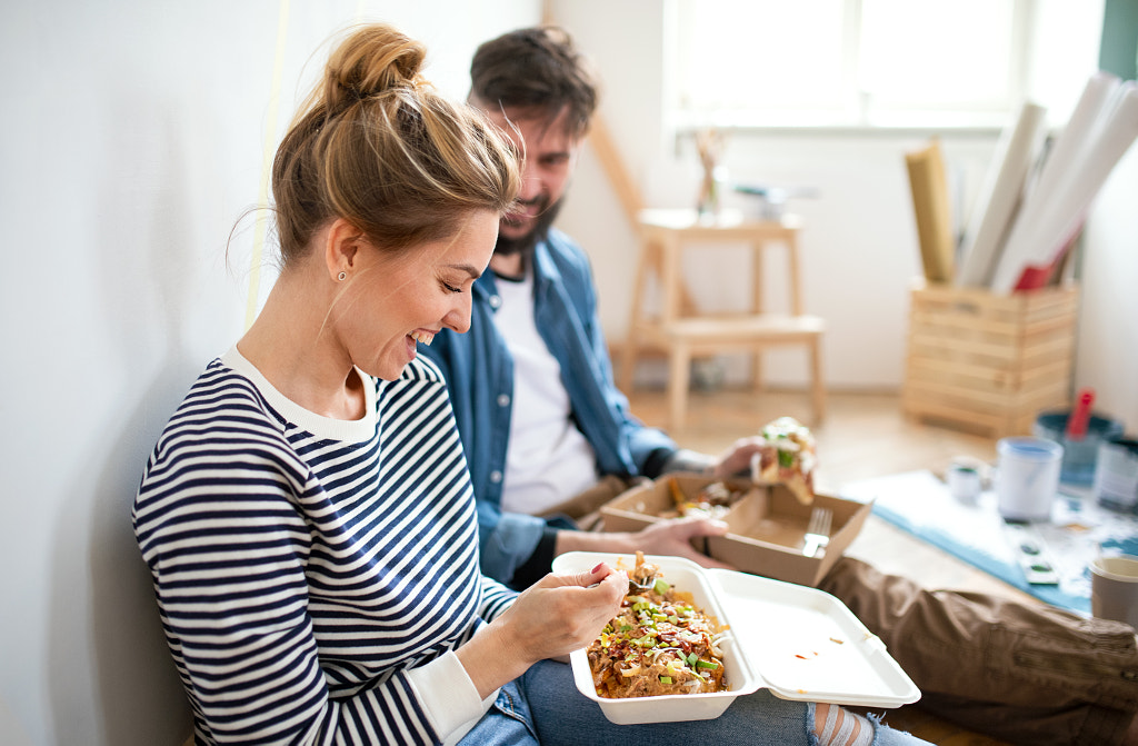 Couple eating lunch indoors at home, relocation, diy and food delivery by Jozef Polc on 500px.com