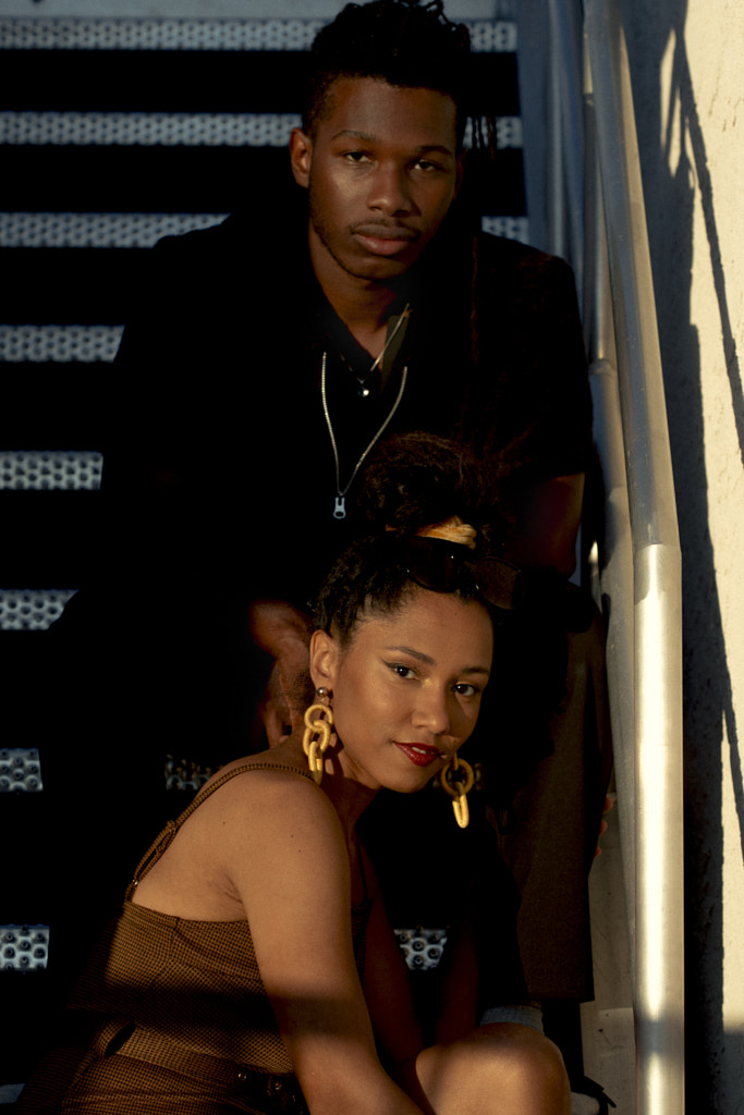 young couple seated on staircase by Hagar Wirba on 500px.com