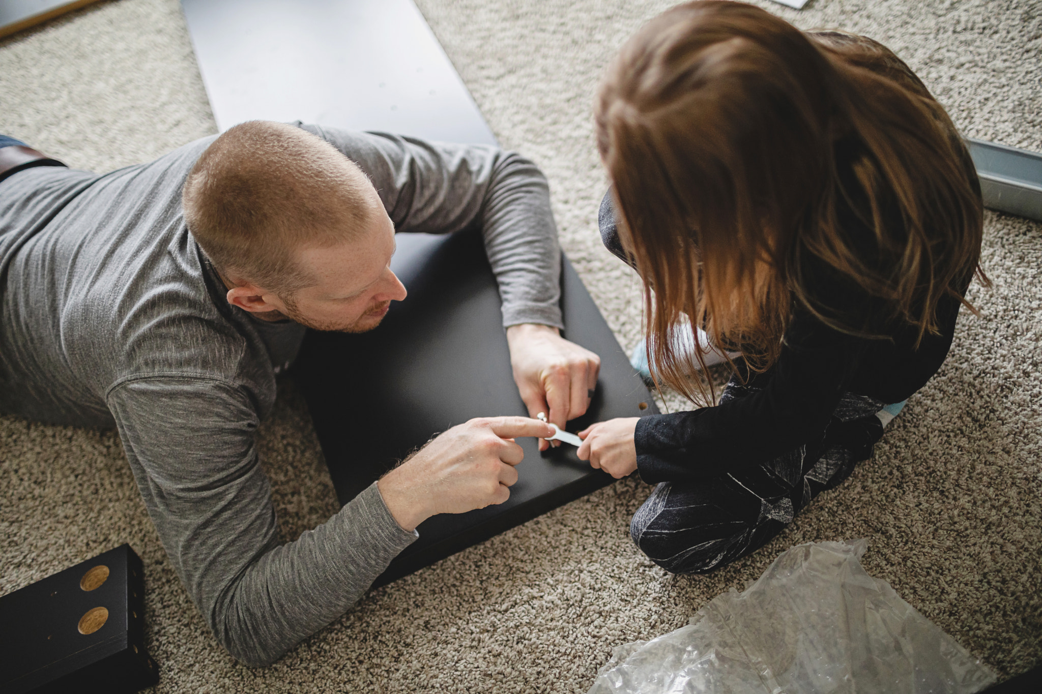 Father Teaching His Daughter to Put Furniture Together, Missouri