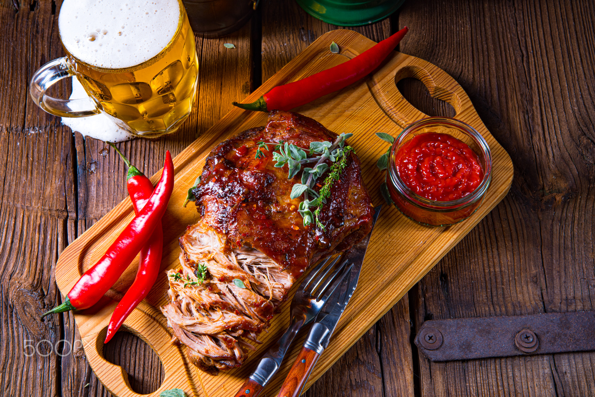 Pulled pork out of the oven with beer sauce