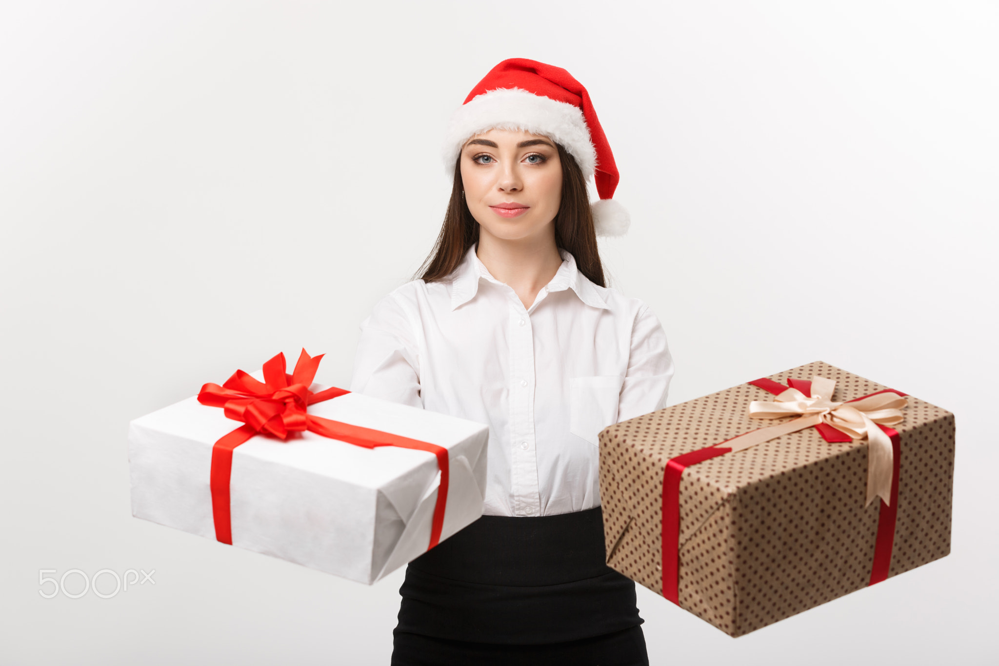 Christmas Concept - young happy caucasian business woman with santa