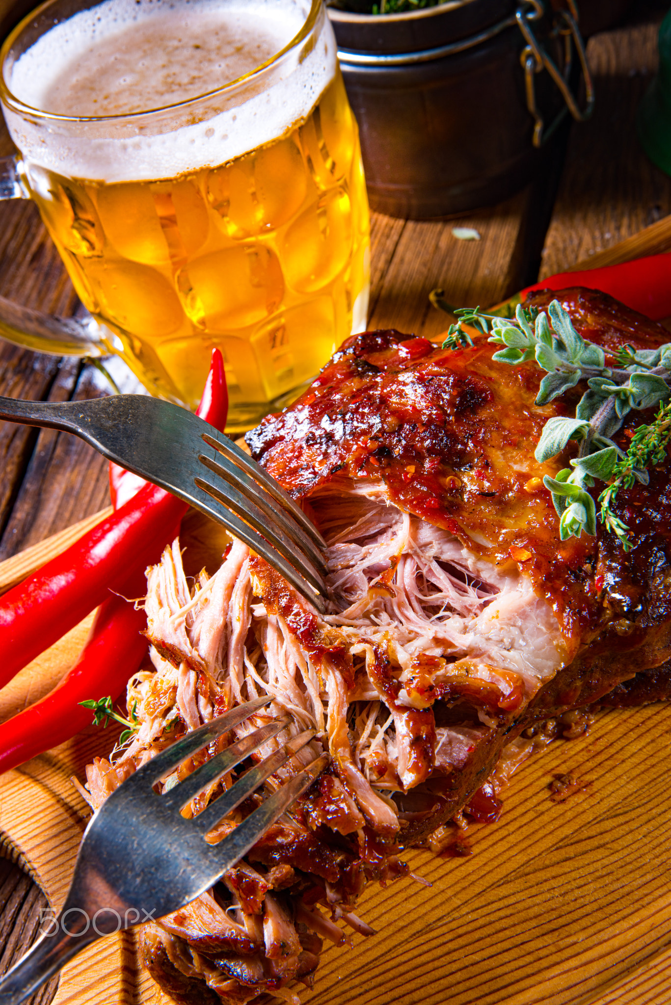 Pulled pork out of the oven with beer sauce