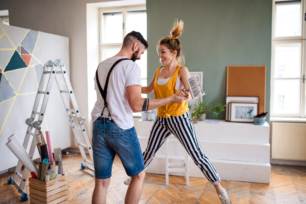 Couple having fun when painting wall indoors at home, relocation and by Jozef Polc on 500px.com