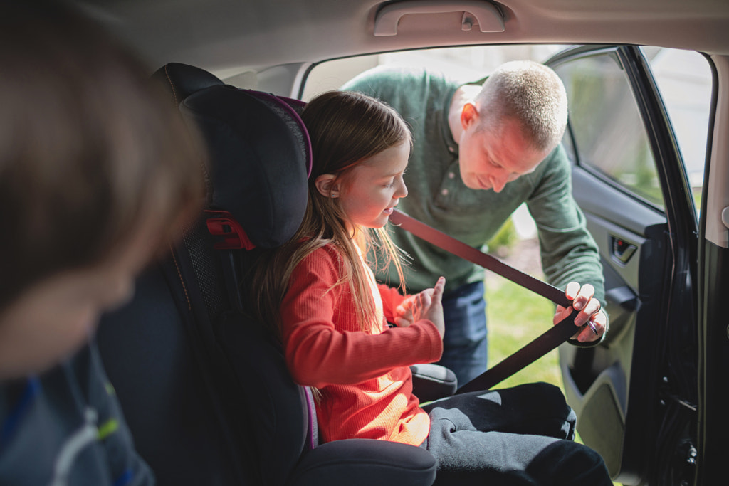 Father Buckling Daughter in Car Seat, St. Charles, MO, USA by Nadia M on 500px.com