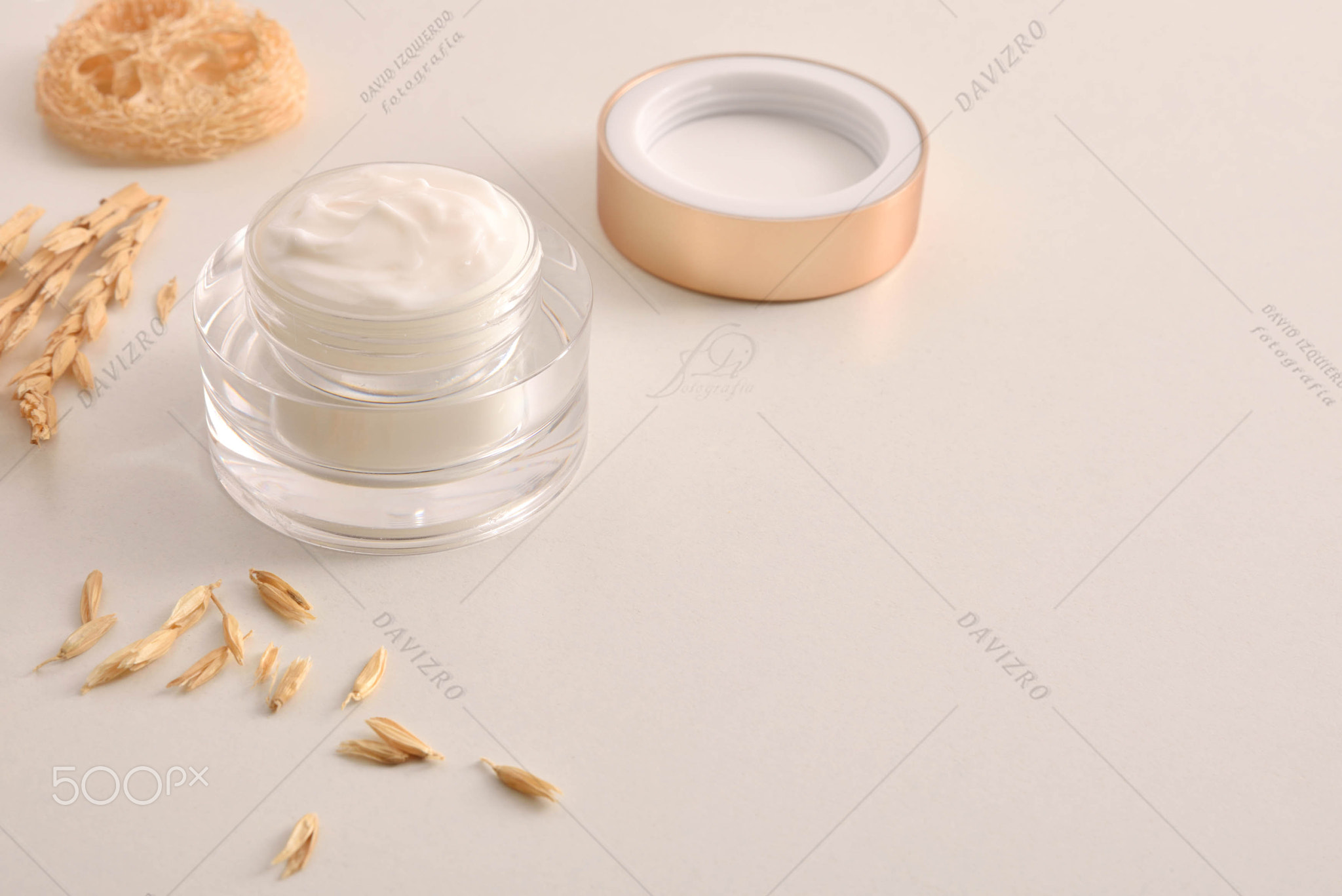 Background with oat moisturizer cream with spikes elevated view