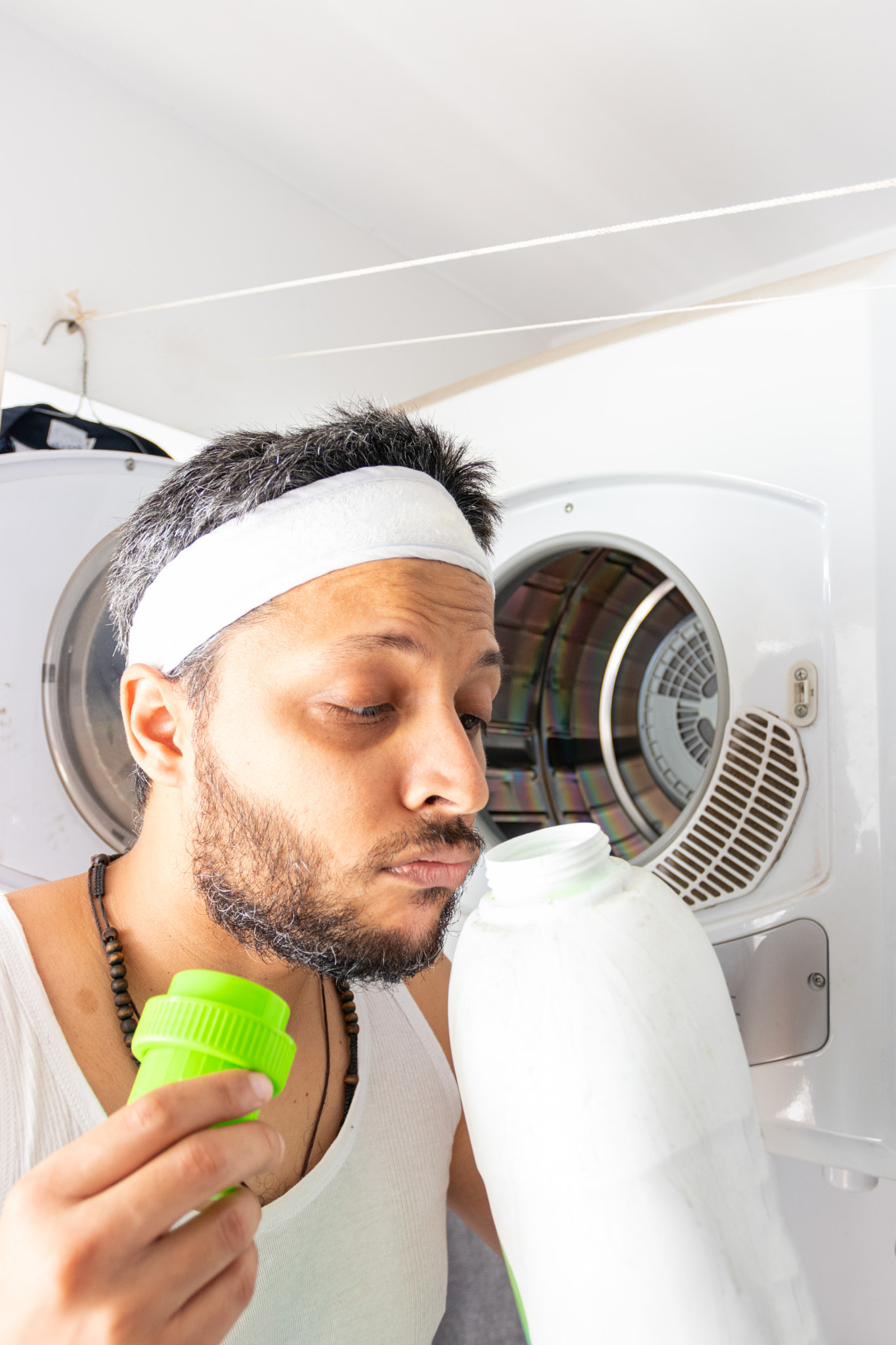 Young man with headband going to wash your dirty laundry