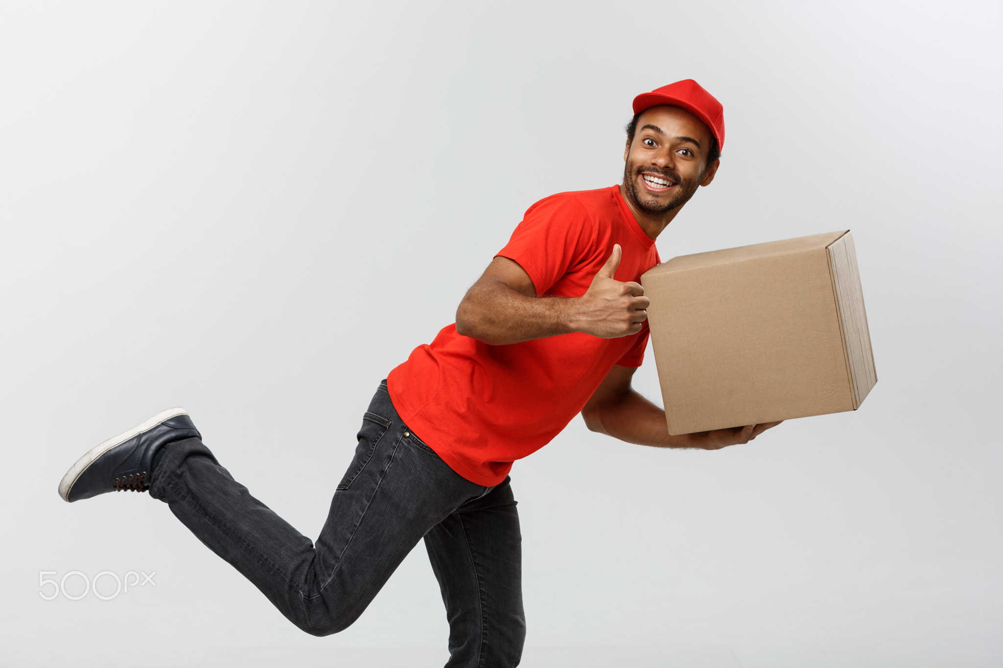 Delivery Concept - Handsome African American delivery man rush running