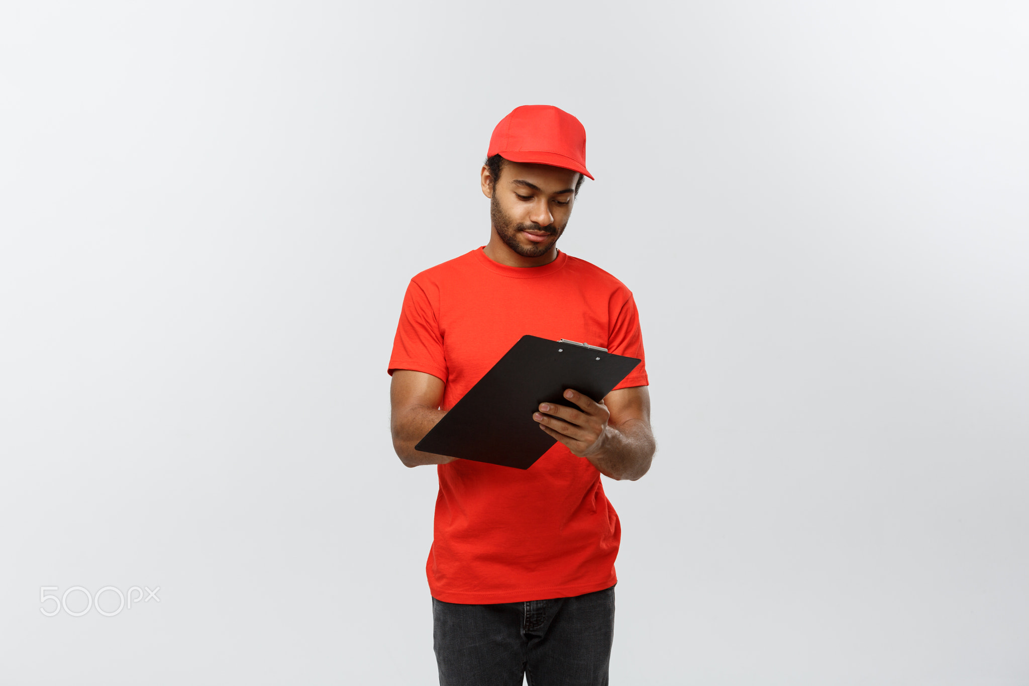 Delivery Concept - Portrait of Handsome African American delivery man