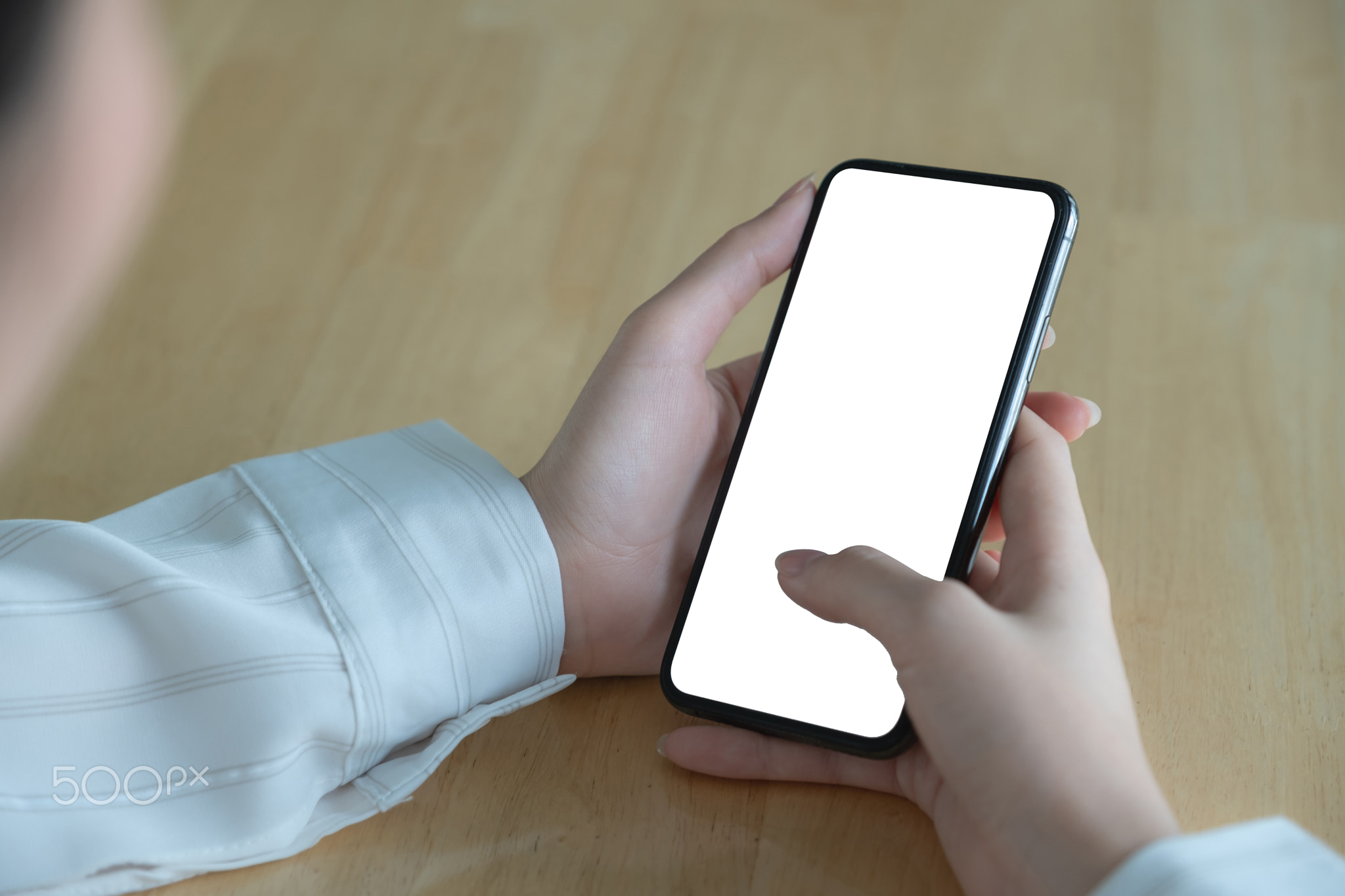 Asian woman holding smartphone with blank screen frameless modern