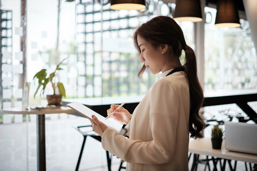 Businesswoman owner make ads. Open now on social media. Cafe or by Worawee Meepian on 500px.com