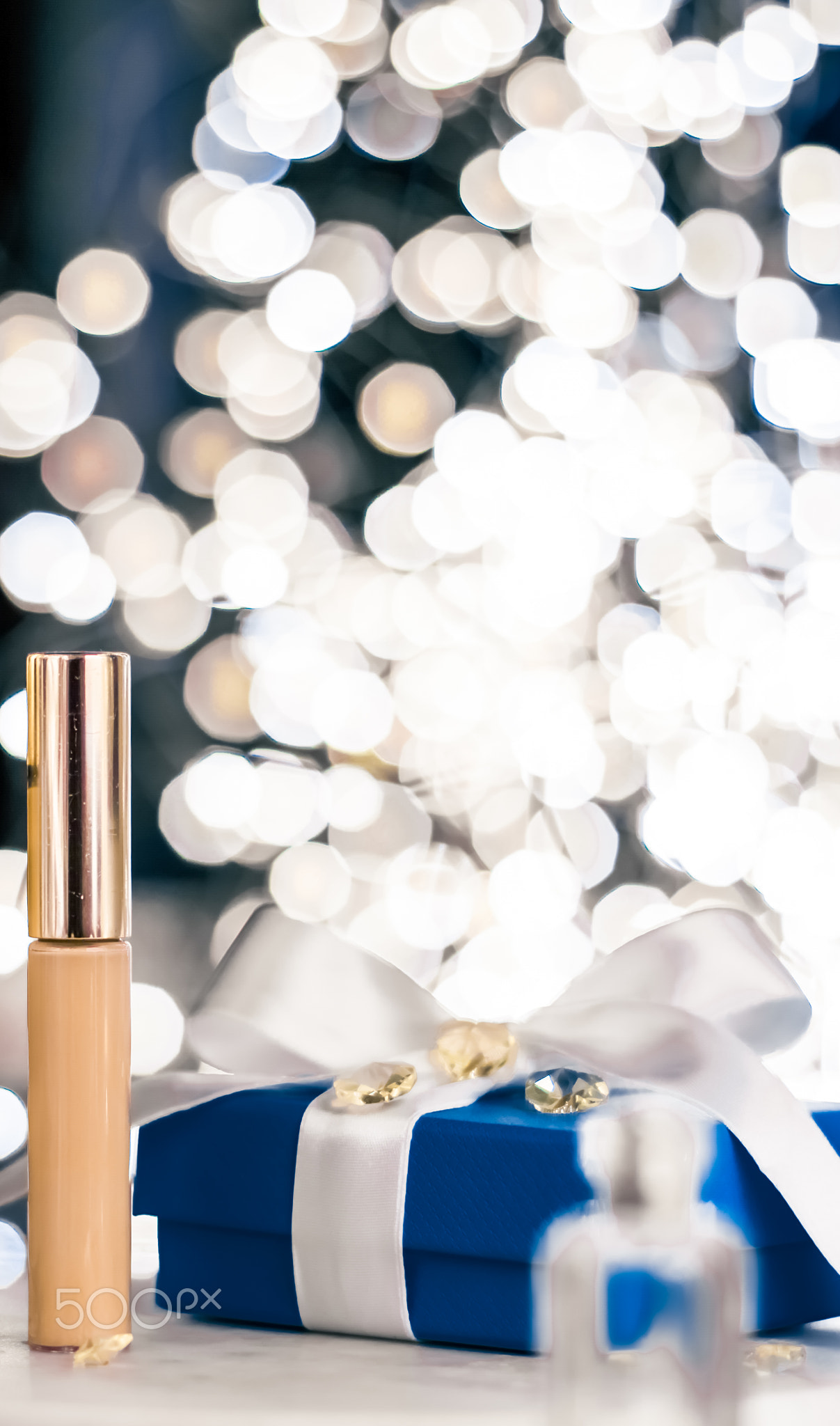 Holiday make-up foundation base, concealer and blue gift box, luxury
