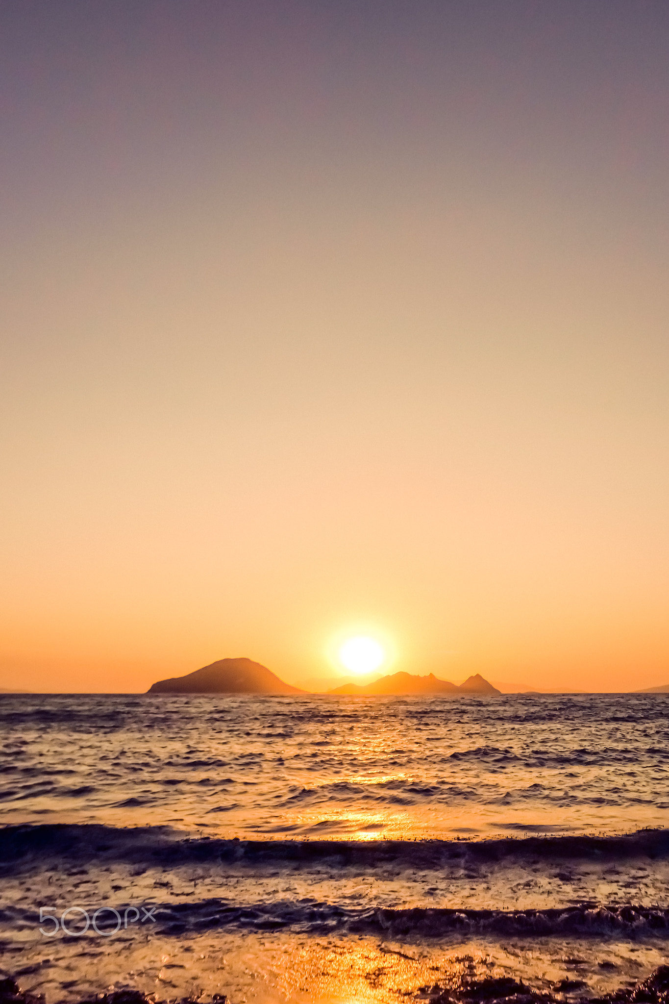 Summer sunset at the Mediterranean sea coast, seascape and mountain