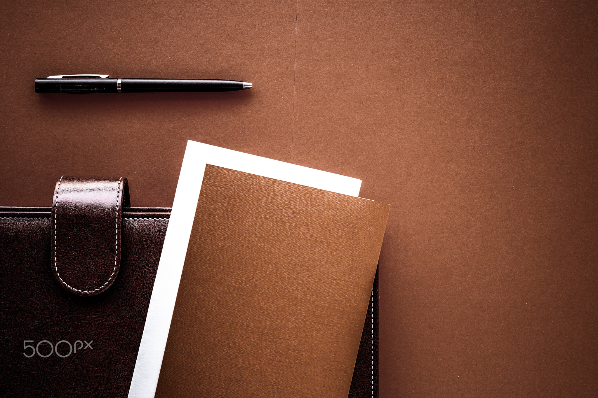 Vintage business briefcase on the office table desk, flatlay