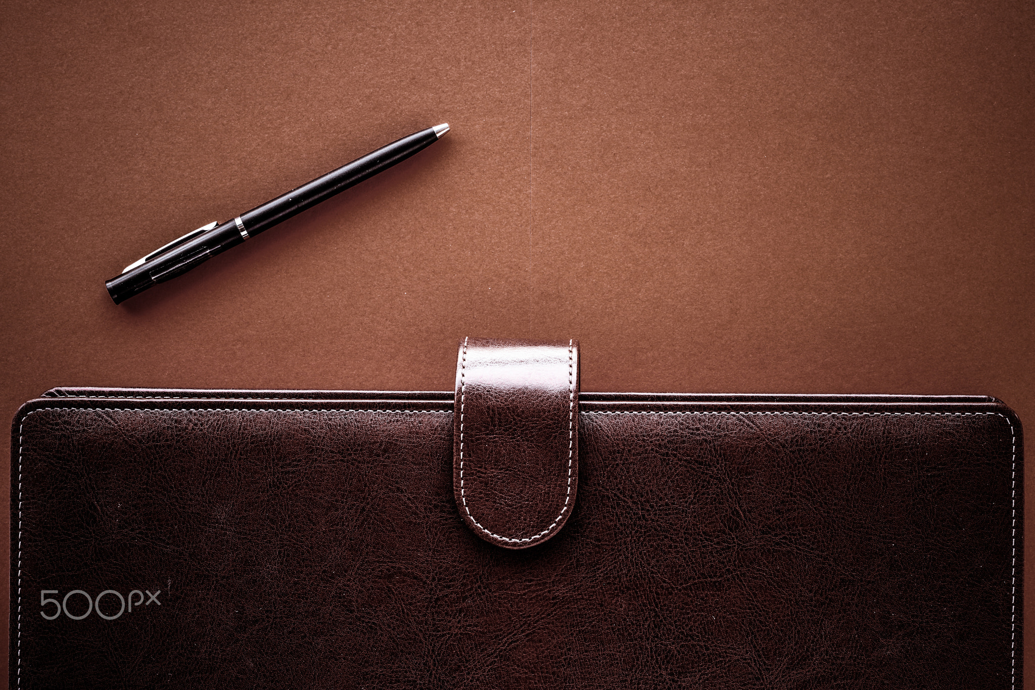 Vintage business briefcase on the office table desk, flatlay