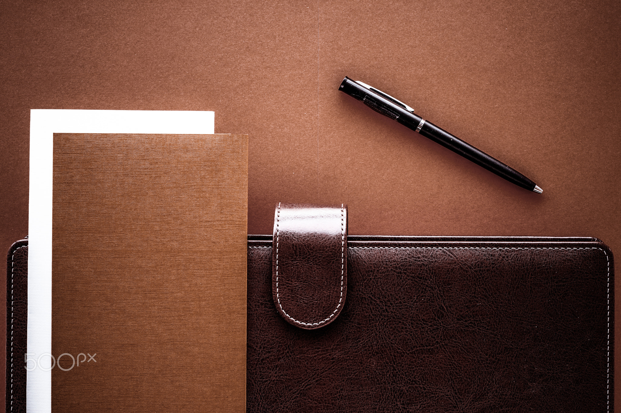 Vintage business briefcase on the office table desk, flatlay