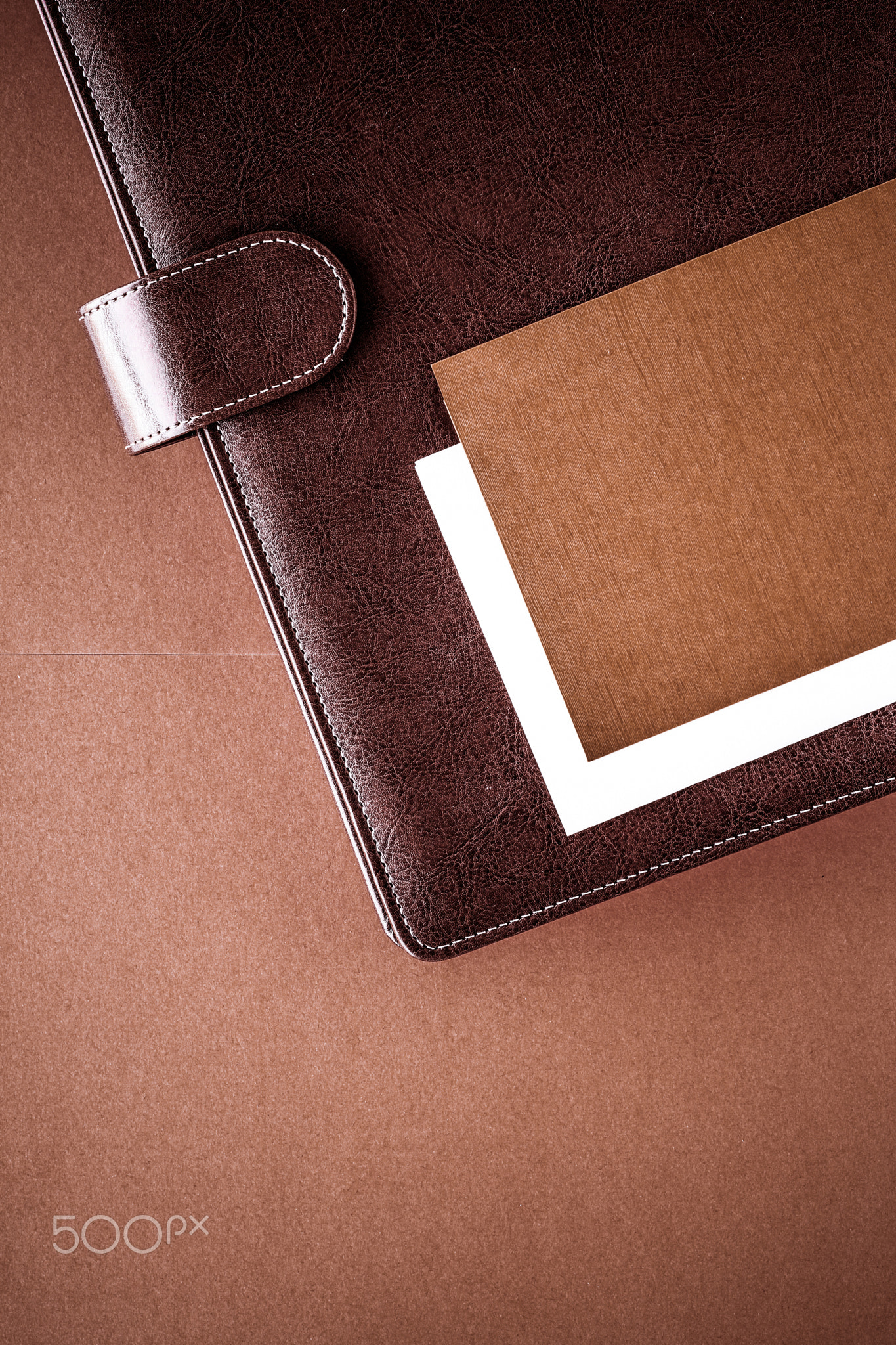 Vintage business briefcase on the office table desk, flatlay