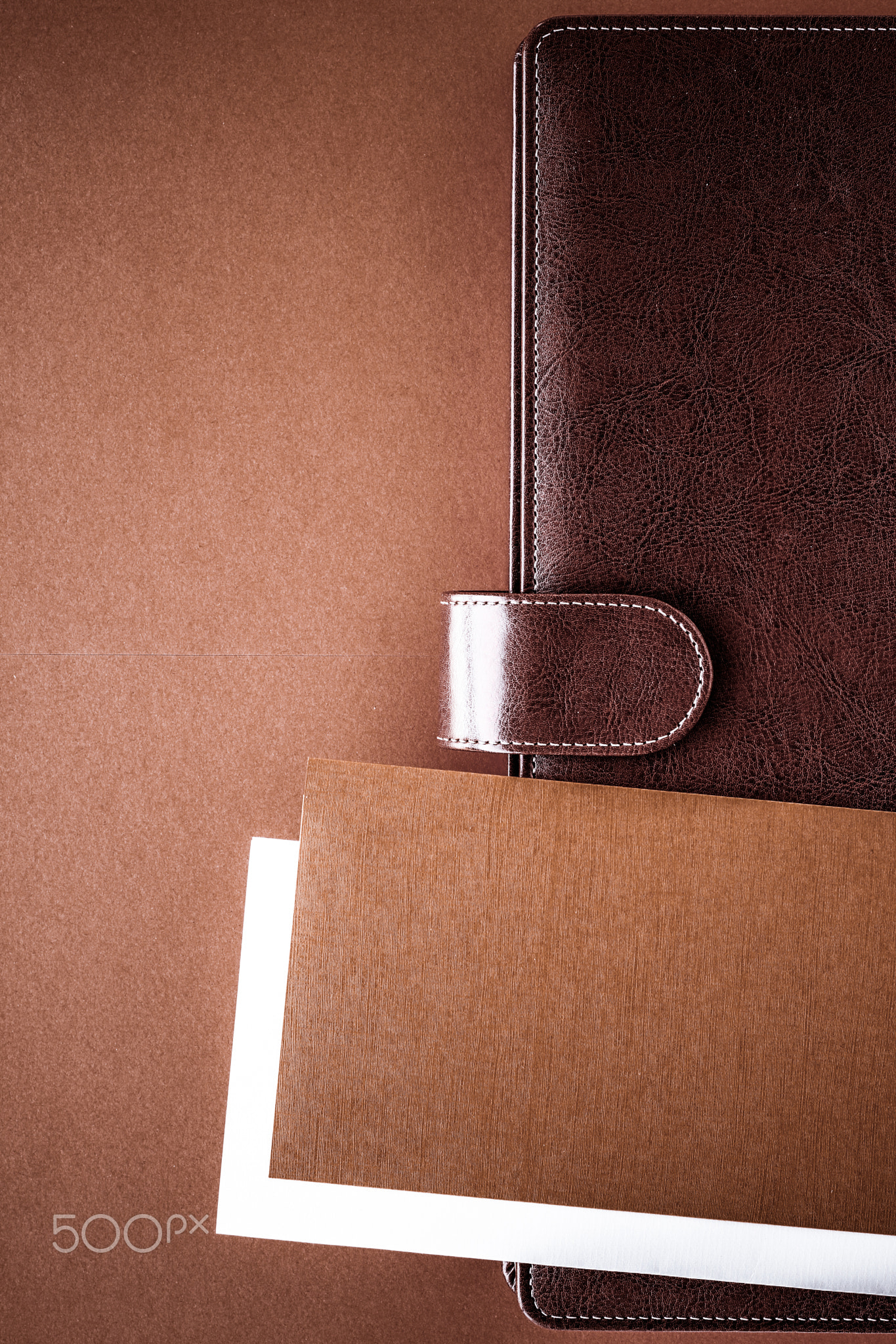Vintage business briefcase on the office table desk, flatlay