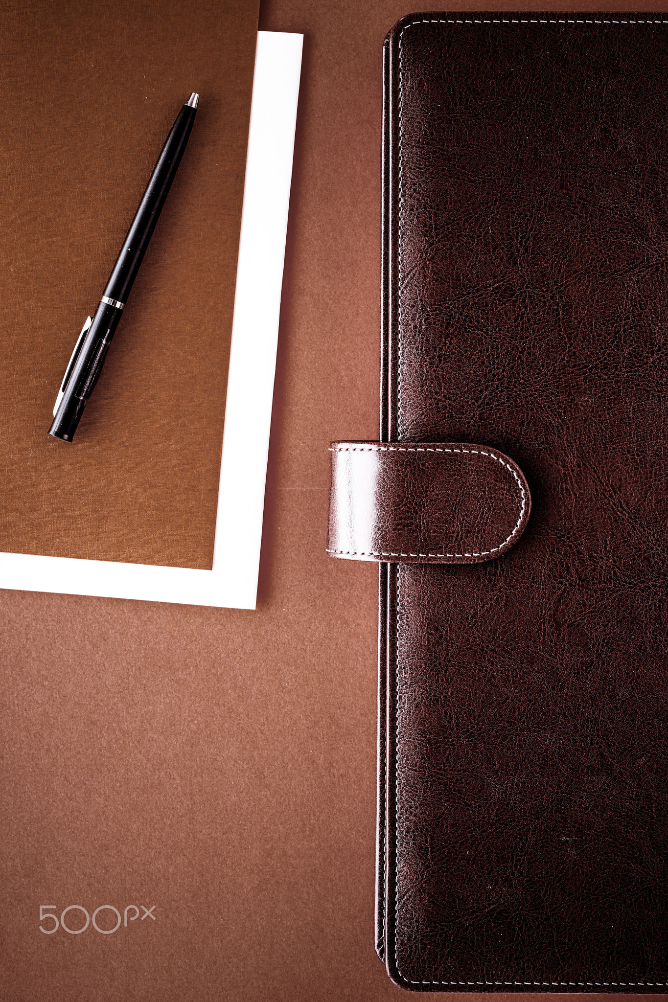 Vintage business briefcase on the office table desk, flatlay