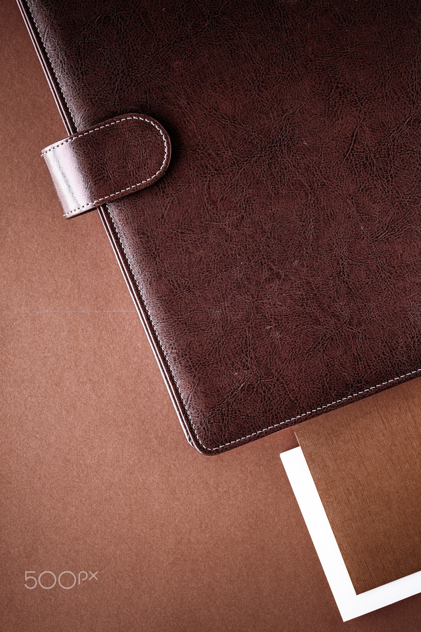 Vintage business briefcase on the office table desk, flatlay