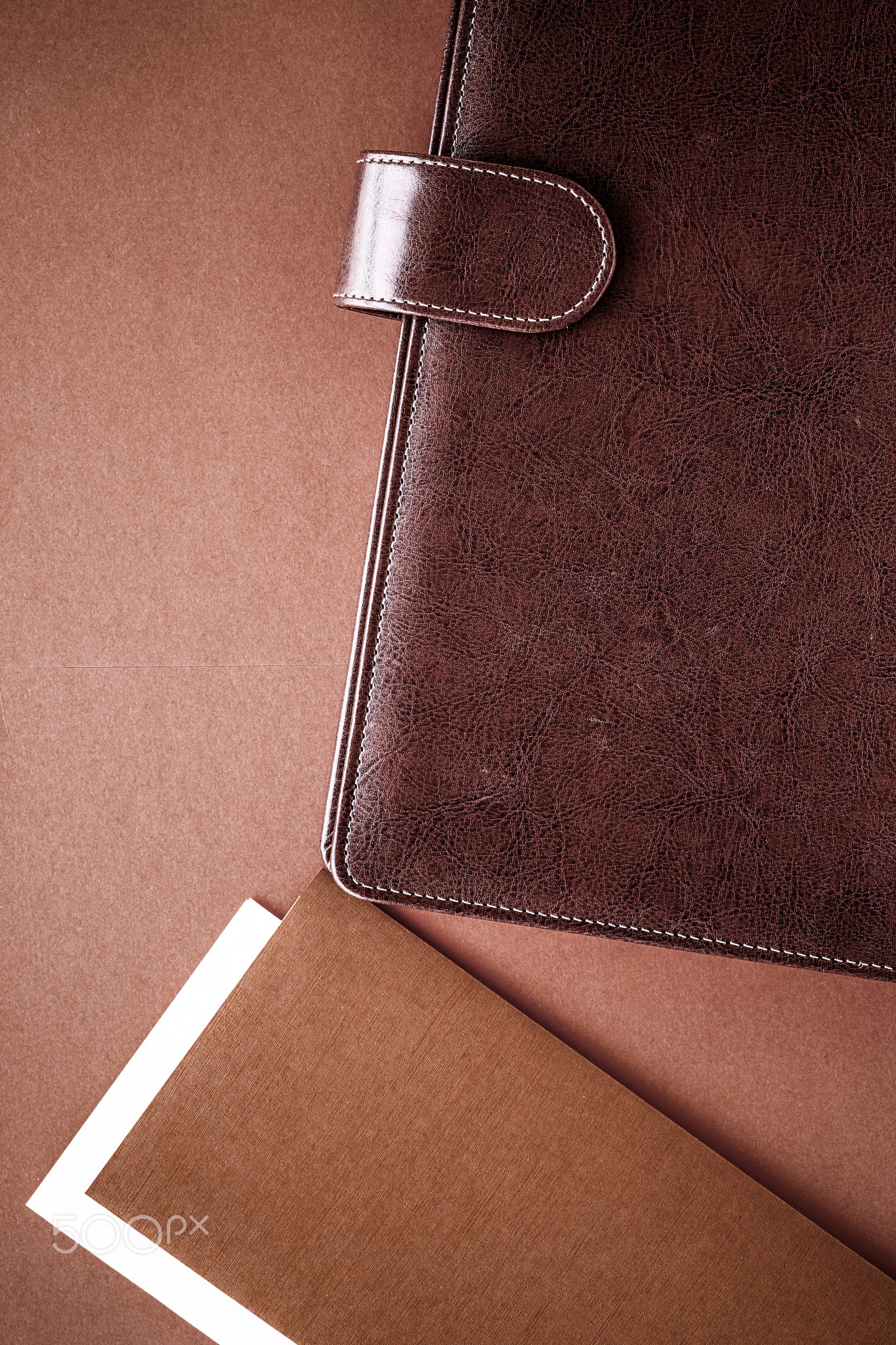 Vintage business briefcase on the office table desk, flatlay