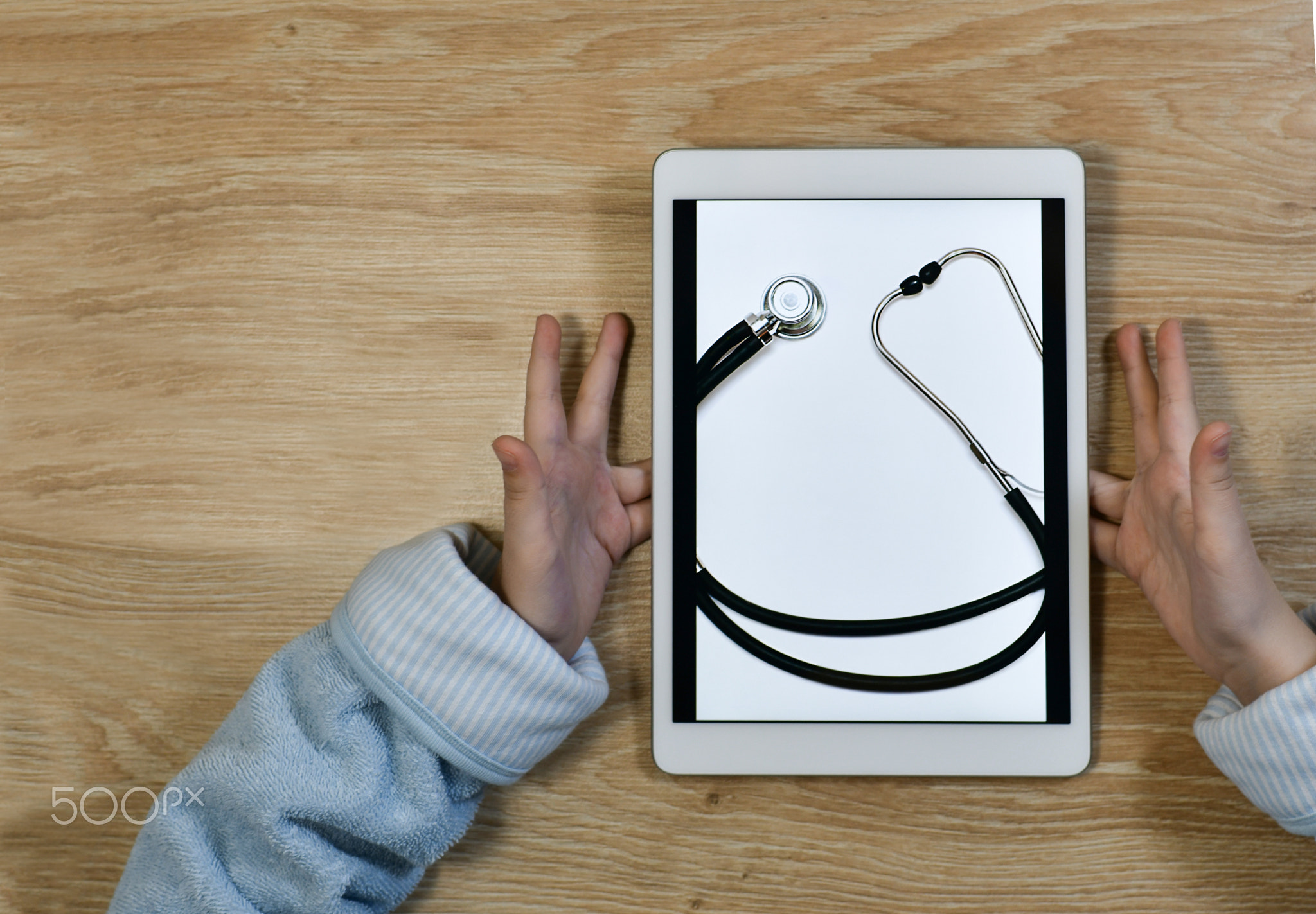 Medical online care. Smile of a stethoscope on the screen and joyful