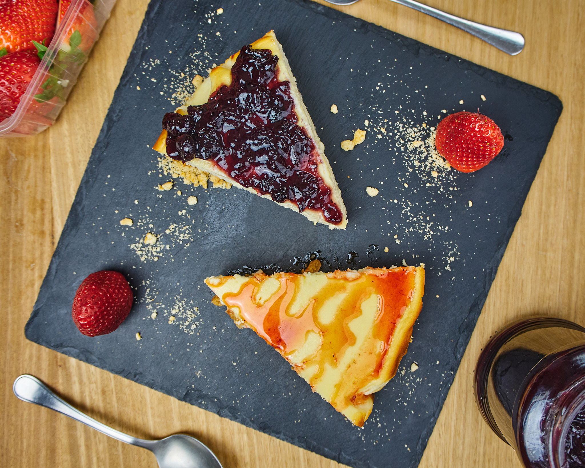 Set of cheesecakes with two Strawberries and topping. Top View