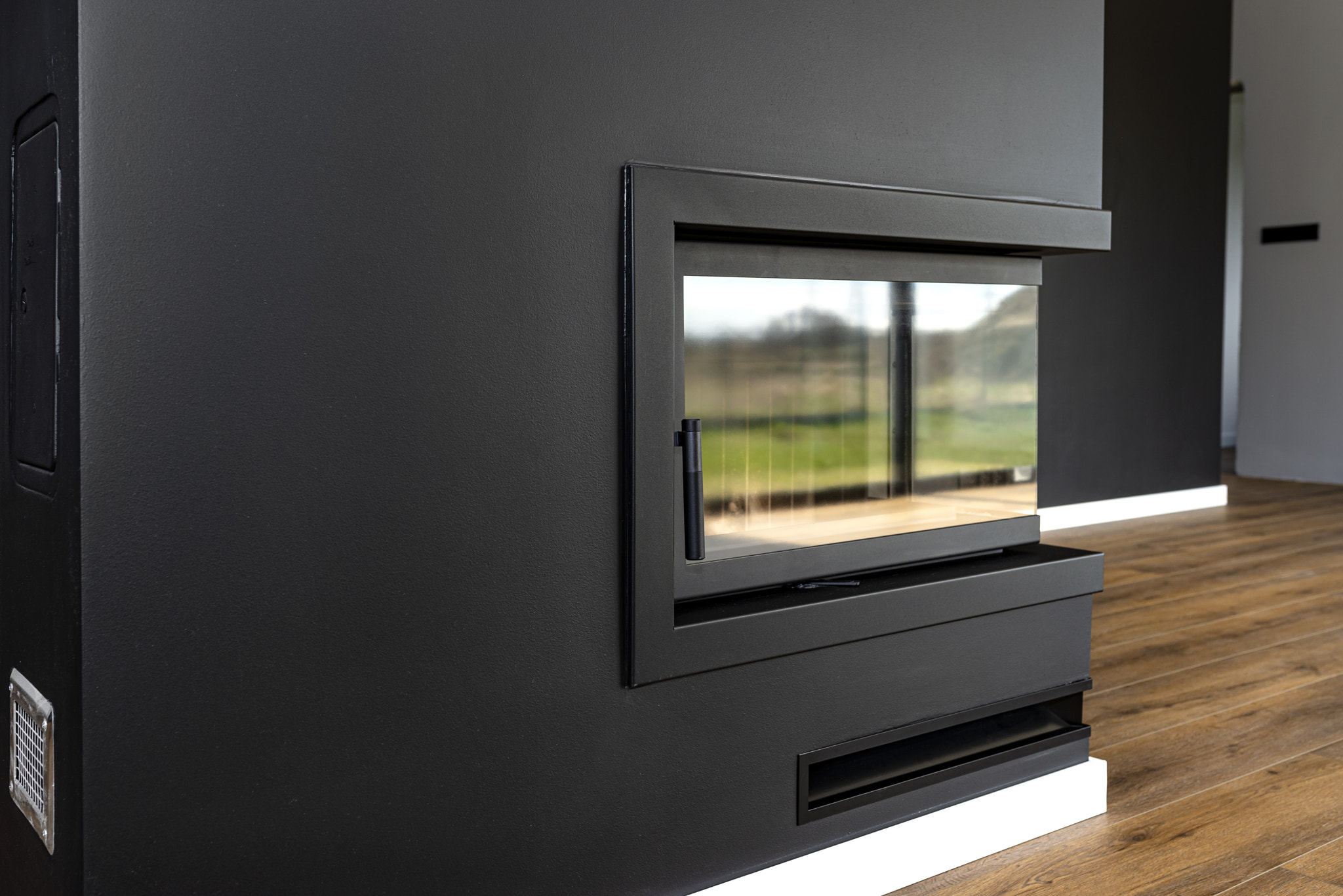A modern fireplace with a closed combustion chamber standing