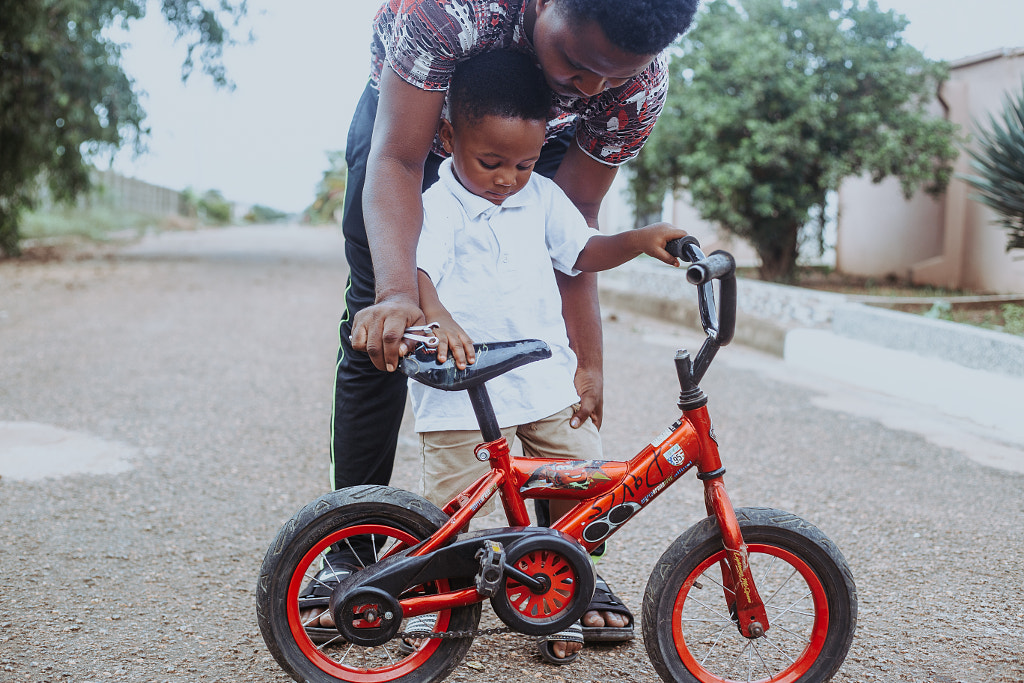 father teaching son biking by Junior Asiama on 500px.com