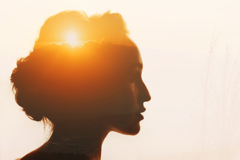 Woman with sunset and clouds beyond her head. Self-restraint and self by Max Chernishev on 500px.com