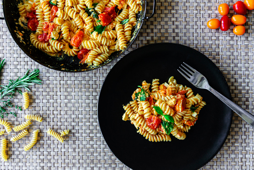 Baked feta cheese with pasta, tomatoes and fresh basil by Eva Soukupová on 500px.com