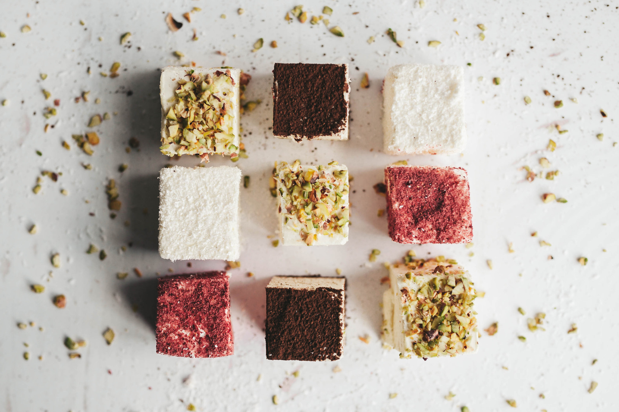 Assorted homemade candy bird's milk on white background