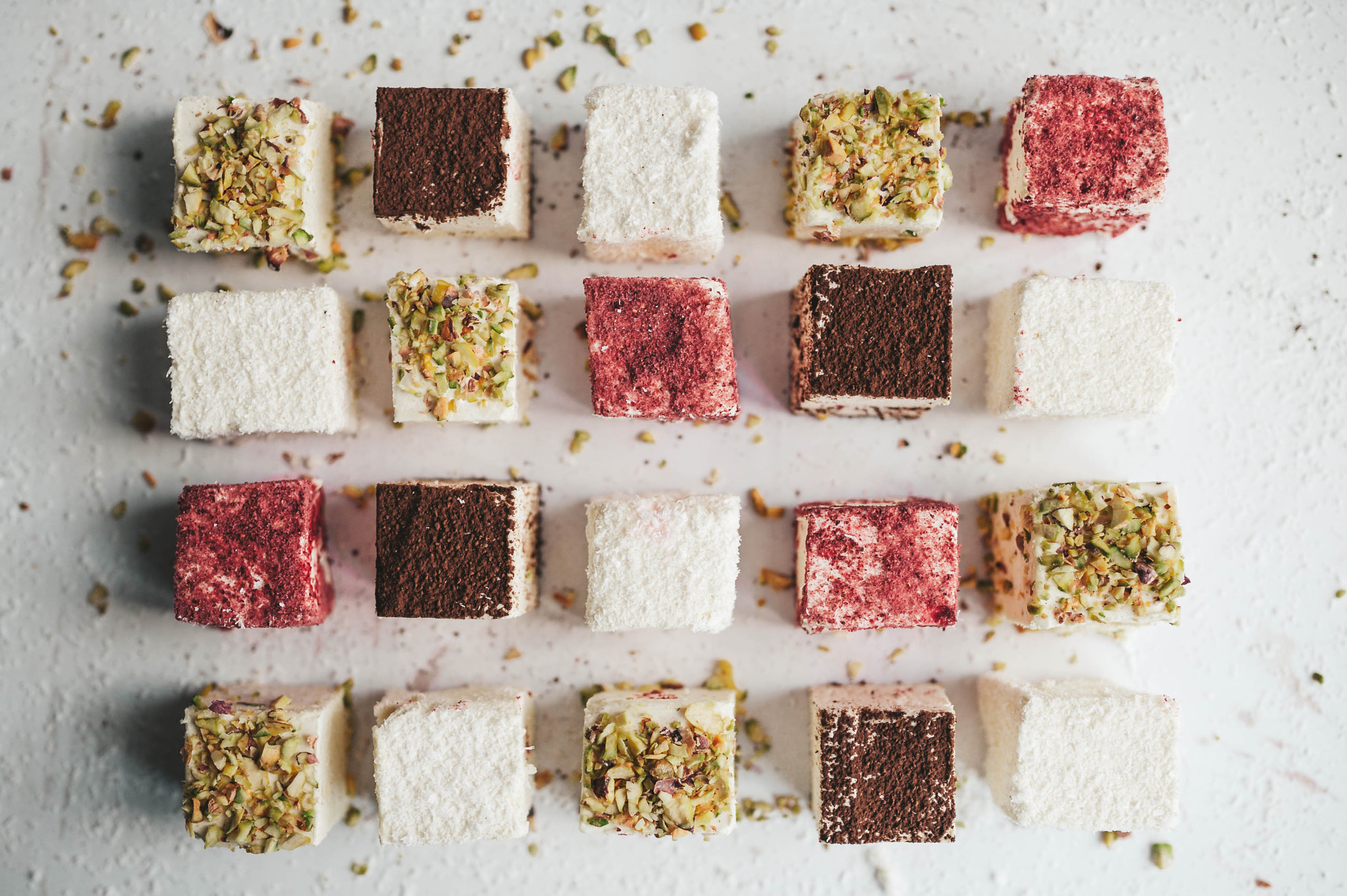 Assorted homemade candy bird's milk on white background