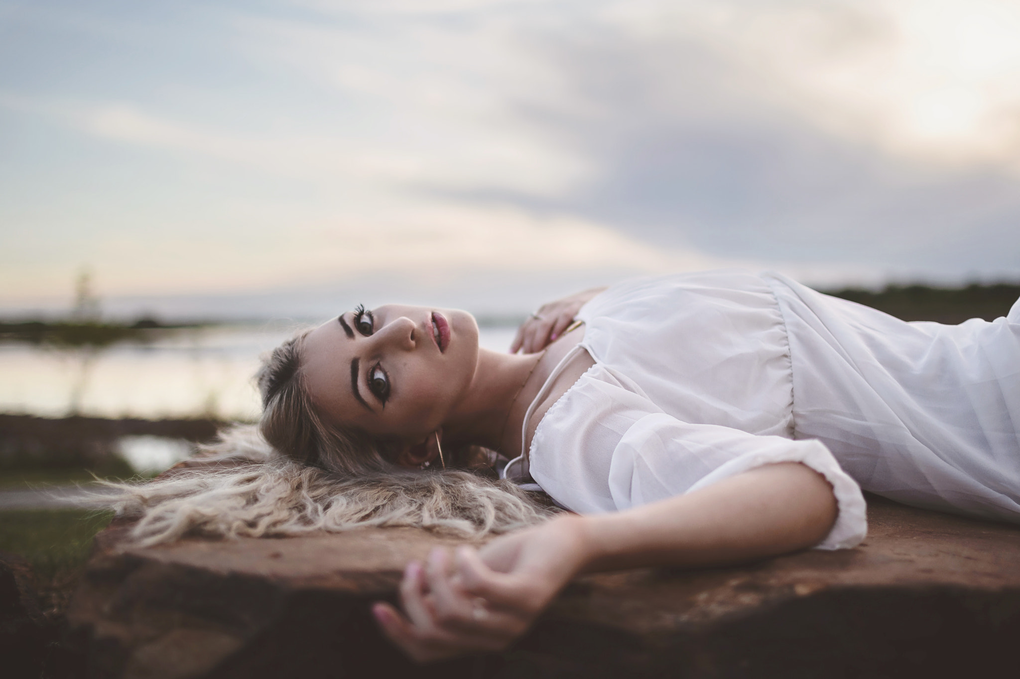 Young Lovely Woman on Rocks Outside Relaxing, St. Peters, MO, USA