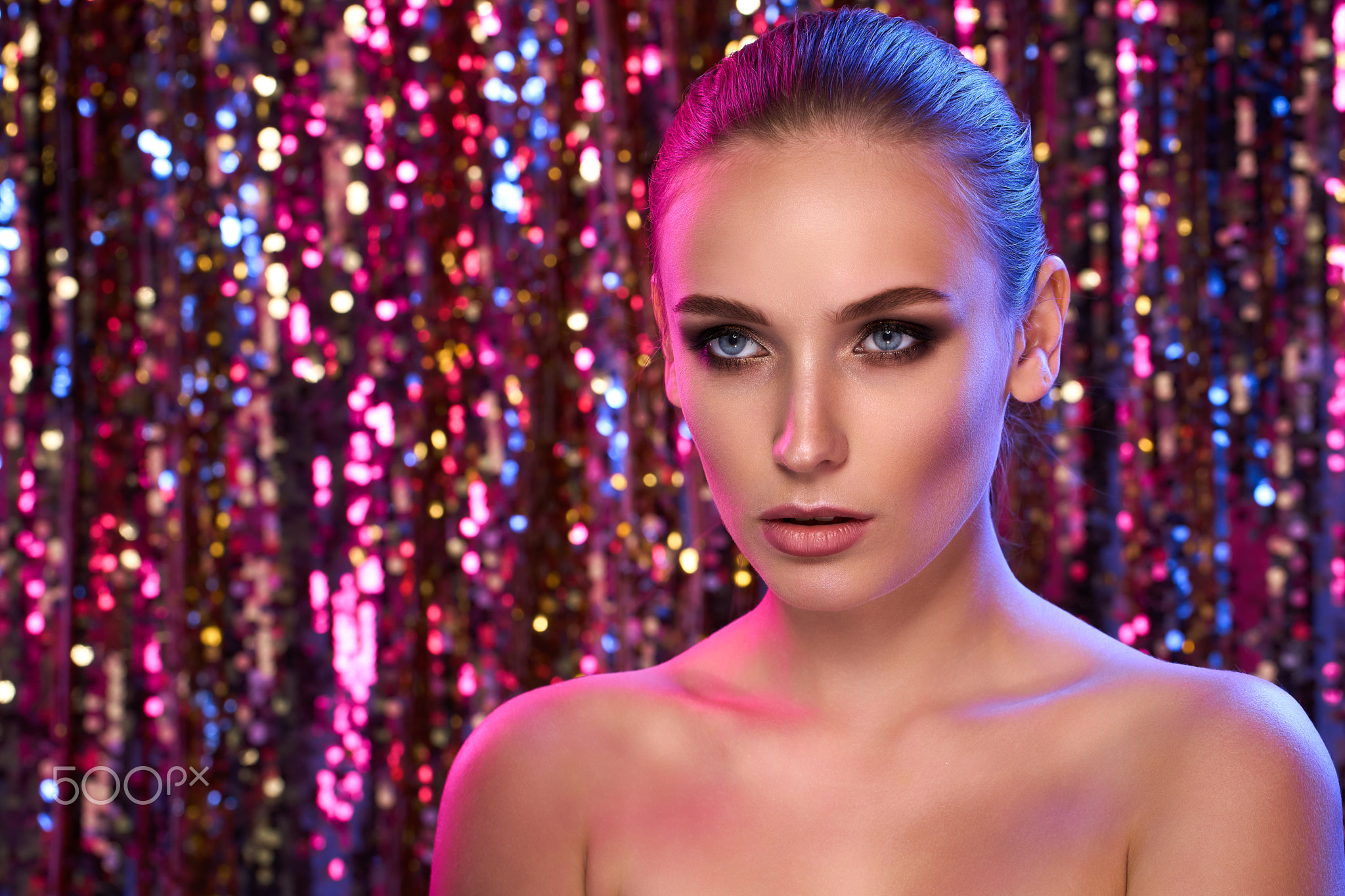 Beauty portrait of a High Fashion model woman in colorful bright neon