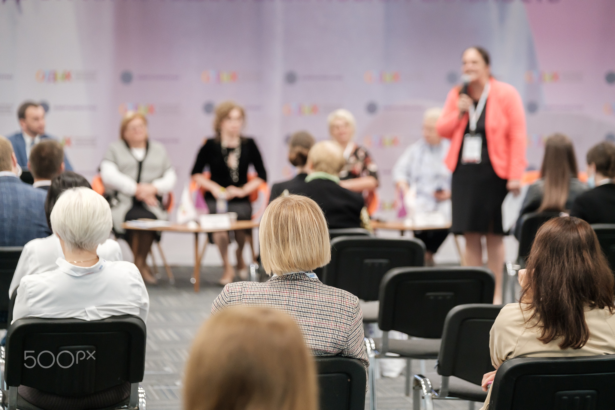 Business speaker doing presentation to audience