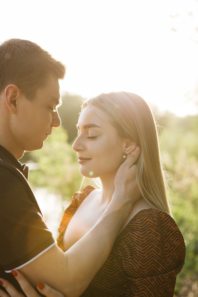 young guy touches a girl by the neck in Tver park, Russia by Alena Sadreeva on 500px.com